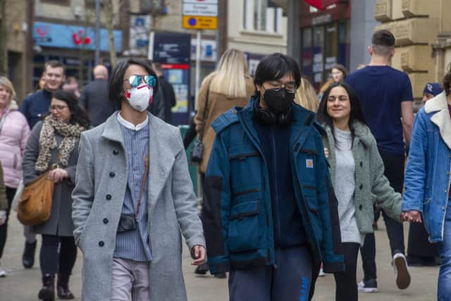 Shoppers take precautions after the outbreak of coronavirus. Picture Tony Johnson.