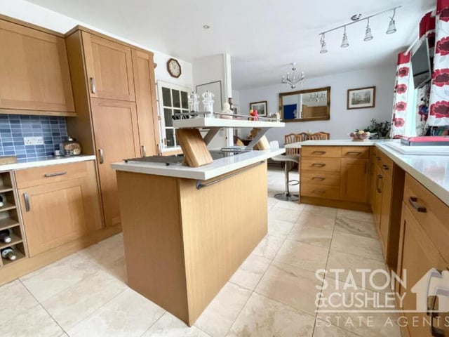 Let's focus now on the sizeable kitchen/diner at the Mansfield Woodhouse property. The room creates the perfect space to cook, dine and socialise with the family. It includes a free-standing island with a fitted oak drawer and base units.