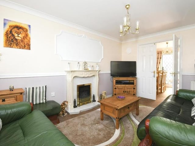 From the entrance hall, you are immediately directed to this pleasant living room or lounge. It has a feature fireplace and also a bay-fronted window overlooking the front of the property.