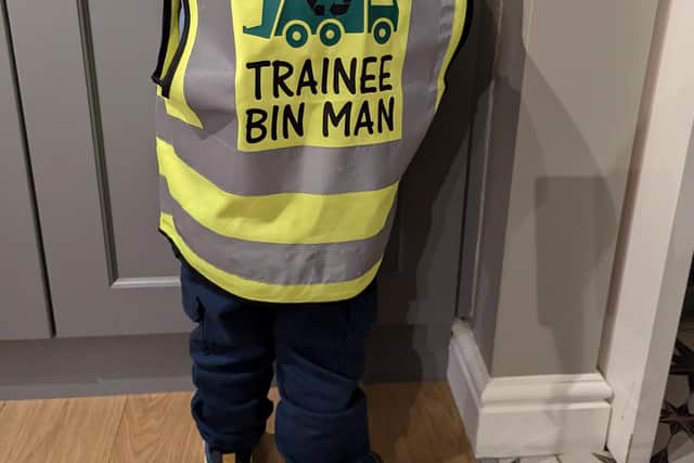 Jude showing off his trainee bin man high vis' vest