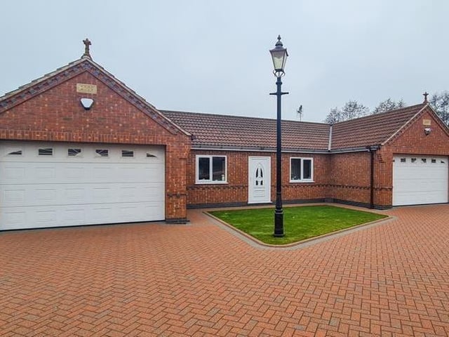 This part of the Calverton property includes two double garages.