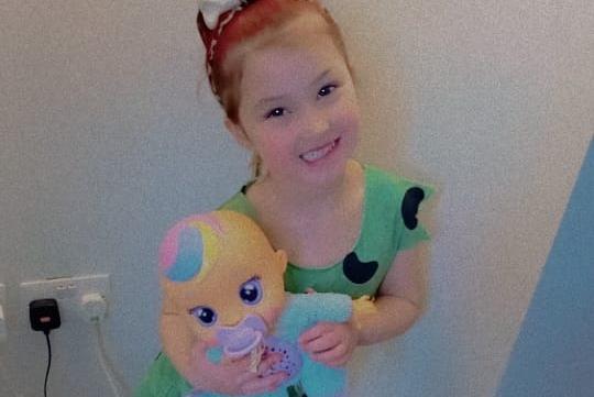 Sophie, age 5, dressed as Pebbles from The Flintstones.