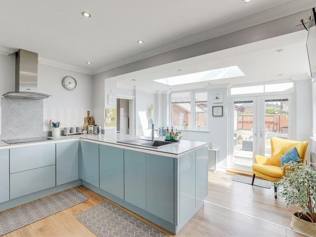 The kitchen really is the heart of the home, especially as it flows seamlessly into a dining area. It boasts a range of fitted gloss base and wall units with a wraparound worktop and under-counter, recessed lughting.
