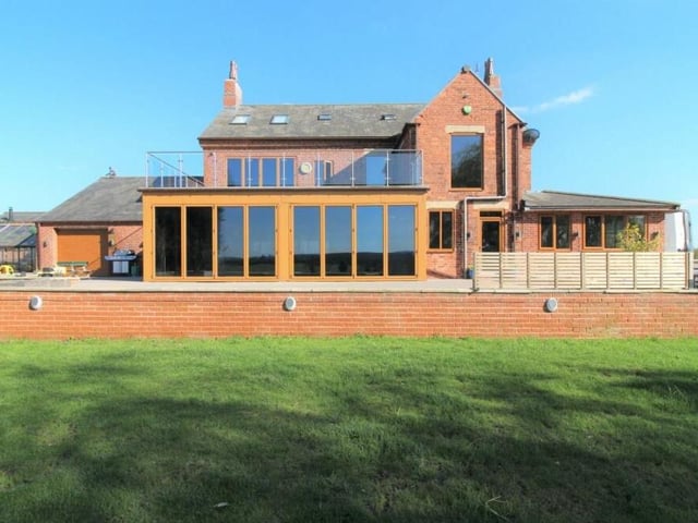 Stand back and admire this view of the rear of the £1.1 million property. To the left is the integral garage.