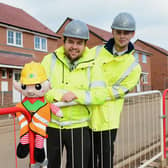 The site team with the elf, who are promoting staying safe on site