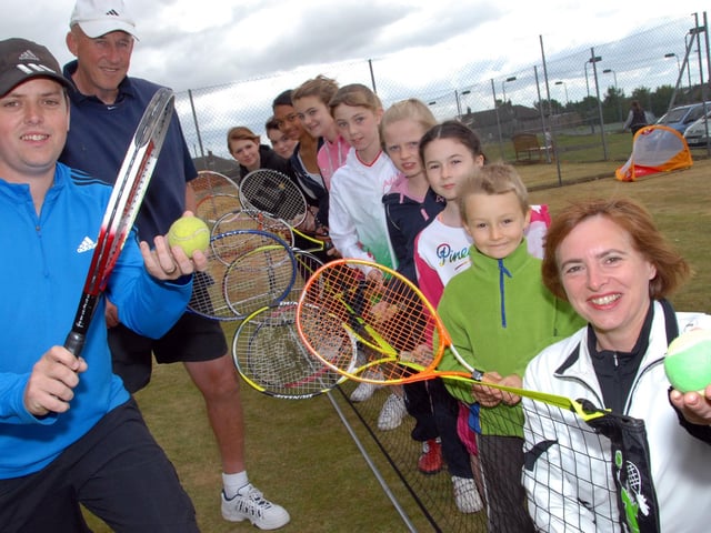 Coaches Stephen Attewell and Mike Collins, left, were joined by Club Chairman Sharon Cox-Smith, right and local youngsters at an Open Day in 2011.