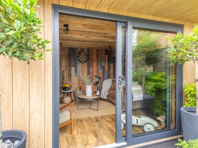 The garden room is an impressive structure, complete with a sliding, double-glazed patio entrance door.