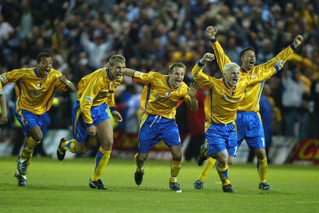 The Mansfield team celebrate after their penalty shoot out win. They would feel the other side of the coin in the final following defeat to Huddersfield Town on penalties.