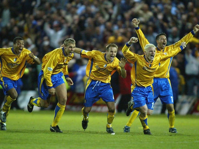 The Mansfield team celebrate after their penalty shoot out win. They would feel the other side of the coin in the final following defeat to Huddersfield Town on penalties.