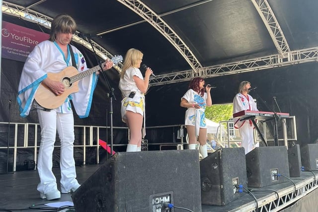 ABBA Fever tribute band performing at Party in the Market.