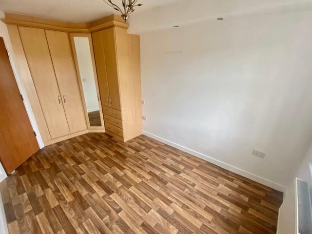 Here is the main bedroom at the Bath Lane apartment. It has wardrobe and storage space, and overlooks the back of the property.
