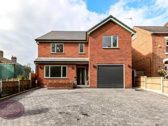 The front of the property is enclosed by timber fencing to the perimeter with flower bed boarders with a range of plants and shrubs and features a brick paved driveway with space for multiple vehicles, leading to the integrated garage fitted with power, electric up & over door and housing the combination boiler.