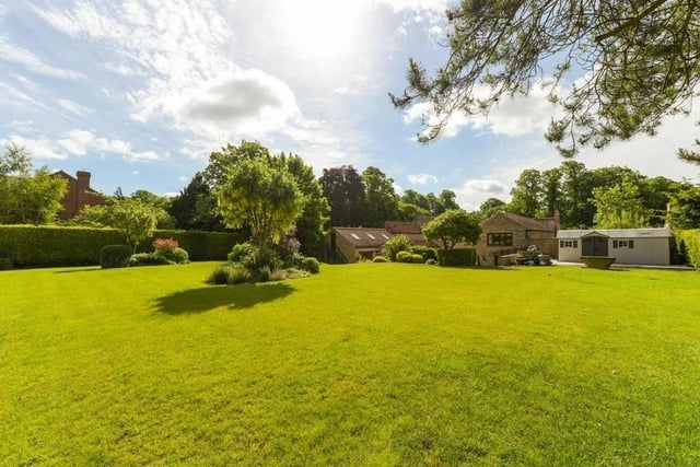 Greenery abounds at the back of the £1.25 million house, with far-reaching views of the countryside.