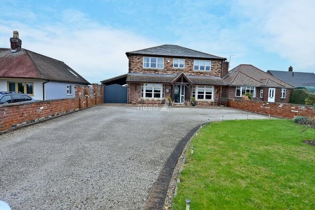 For the last photo in our gallery, we return to the front of the £575,000 Jacksdale property, where a lengthy driveway provides off-street parking space for multiple vehicles.
