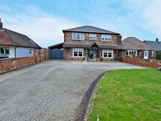 For the last photo in our gallery, we return to the front of the £575,000 Jacksdale property, where a lengthy driveway provides off-street parking space for multiple vehicles.