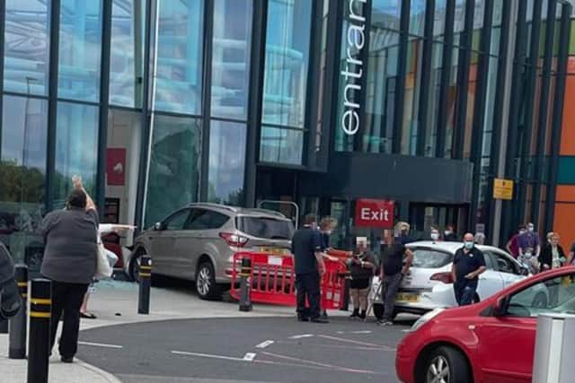The car collided with the glass foyer of the hospital