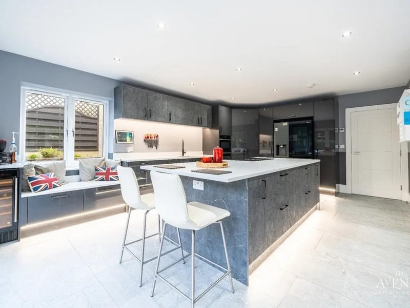 This modern open plan kitchen was installed only a year ago and features quartz worktops and a large island making this the perfect space to prepare your food, as well as socialise. It includes all the anticipated integrated appliances, including a Quooker tap, a wine fridge and a gorgeous utility room.