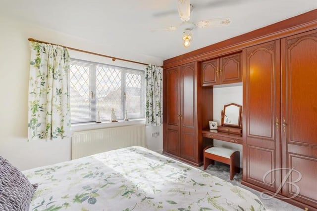 The second, third and fourth bedrooms are all of a similar size and kept to a very high standard. This one overlooks the front of the Holly Drive bungalow and includes fitted wardrobes, a carpeted floor and a central heating radiator.