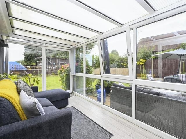 Next to the lounge is this conservatory or sun room, with views of the garden. A nice place to get away from it all and relax.