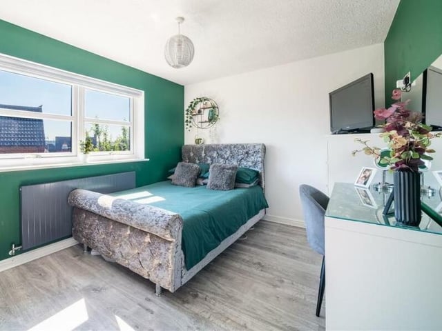 This bedroom is another smart and well-presented retreat, offering space for a desk or dressing table.
