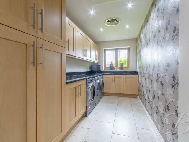 Just off the kitchen/diner is this lengthy, narrow and useful utility room. As well as modern wall and base units, matching those of the kitchen, there is space and plumbing for additional appliances, including a washing machine, tumble dryer and dishwasher