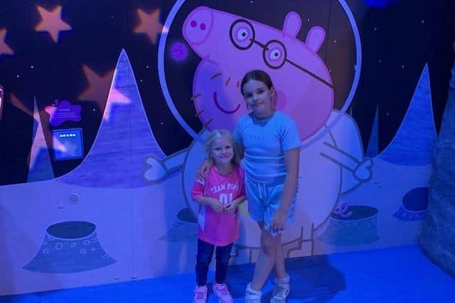 Autumn, four and Primrose, nine, enjoy the interactive experience at the NEC