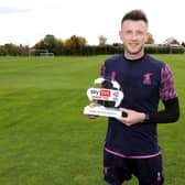 Ollie Clarke with his Goal of the Month trophy.