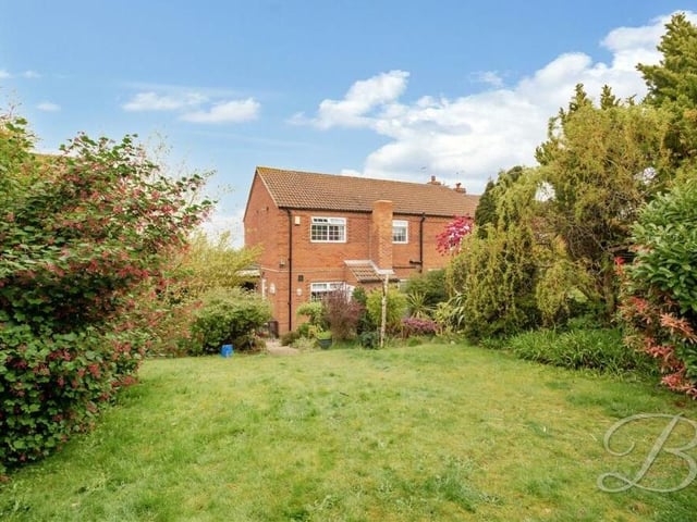 The garden at the back of the house is a fantastic size. It comprises a maintained lawn, patio seating area and mature trees to each side, offering a degree of privacy.