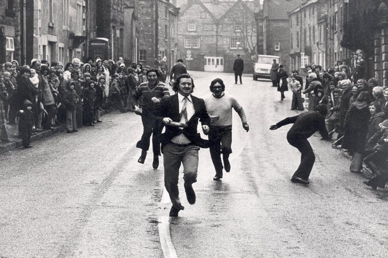 Brian Byard of Bank Road, Matlock wins the Wintsre pancake race for the 2nd year February 1978