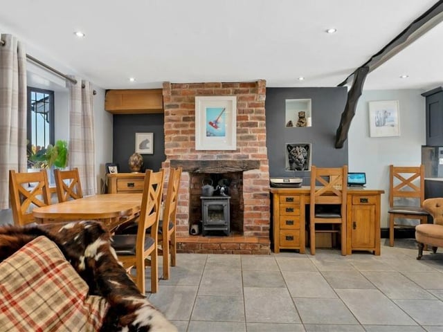 The first room we look at is this open-plan kitchen/diner with living space. A porcelain tiled floor has underfloor heating.