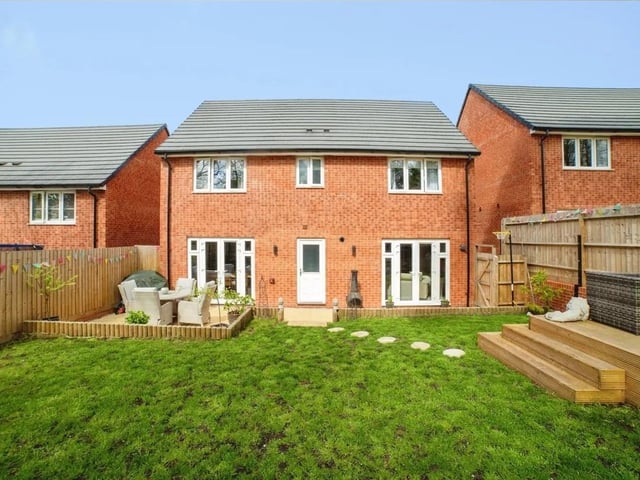 To the rear of the property there is a enclosed garden featuring a slabbed patio area, lawn and raised decked seating area.