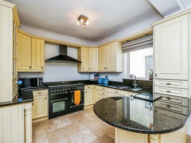 Next stop is the classy kitchen, which is fitted with a range of storage units and cupboards, as well as essential appliances. Culinary experts will not be disappointed.