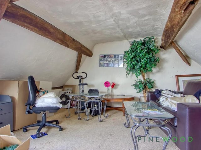 On the second floor are two additional bedrooms, including one cleverly split into two areas, perfect for a study or extra living space
