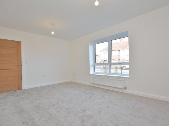 Here is the living room or lounge, which is the main reception room in the bungalow and overlooks the front of the property. There is a radiator, two ceiling-light points, a single power point and three double power points.