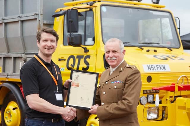 Gary Burnett,  QTS group’s operations director for England and Wales, receives the Armed Forces Covenant award