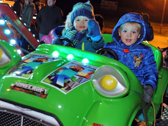 Mansfield Woodhouse firework event. Two year olds, Freddie Orr and Austin Greasley enjoy a fairground ride at Debdale Lane Sports Ground in 2016.