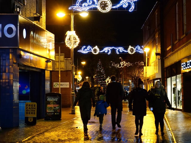 Families walking through the streets at Sutton's Christmas lights switch-on event.