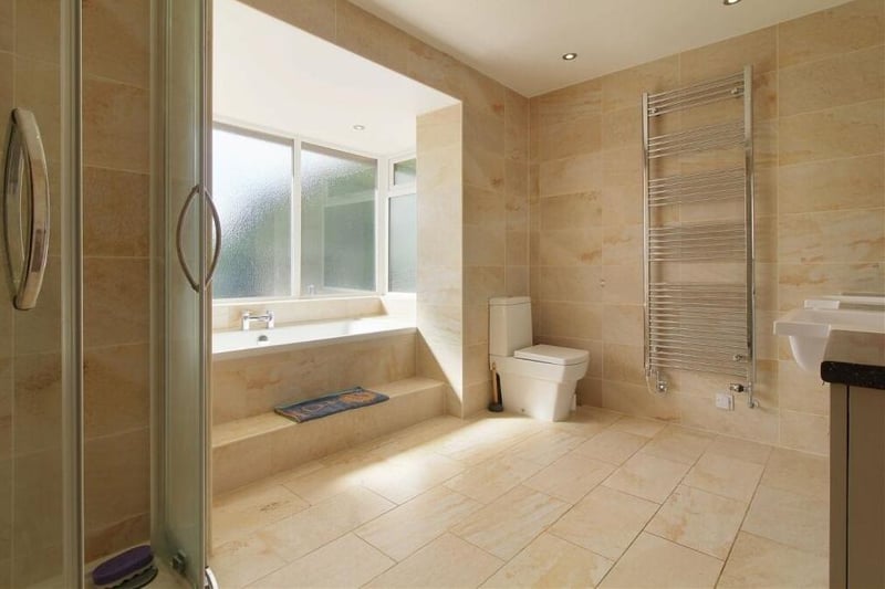 There are no fewer than three bathrooms at the £799,995 Coxmoor Road property, with planning permission in place for a fourth as part of a large extension. This is one of them, complete with bath and shower cubicle.