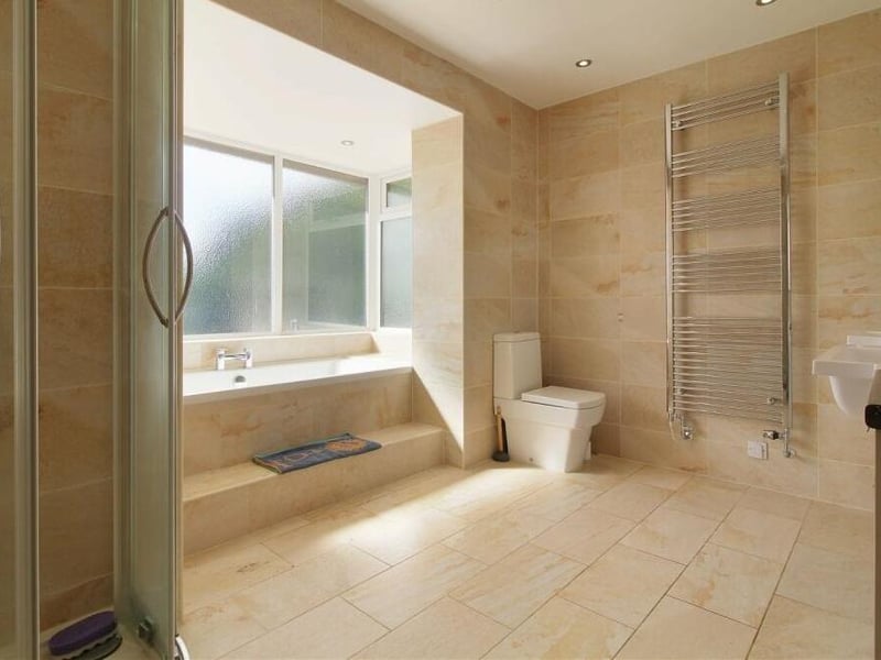There are no fewer than three bathrooms at the £799,995 Coxmoor Road property, with planning permission in place for a fourth as part of a large extension. This is one of them, complete with bath and shower cubicle.