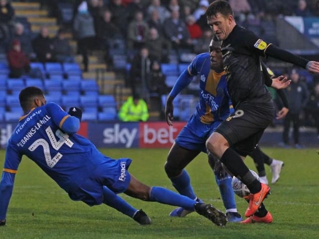 Andy Cook threatens the Shrewsbury goal.