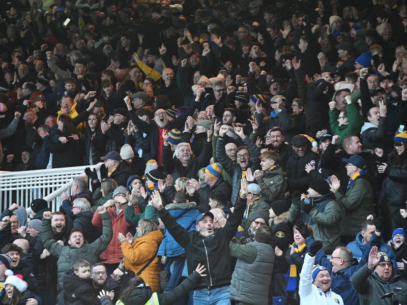 Mansfield Town fans watch the brilliant win at Peterborough United.