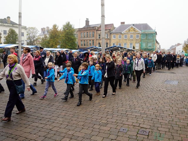 Scouts and cubs marching through the town centre