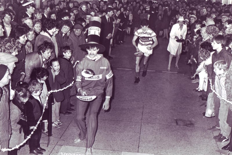 Action from the pancake race in the Arndale Centre between the Arndale managers, Arndale staff and Doncaster Rovers in February 1985.
