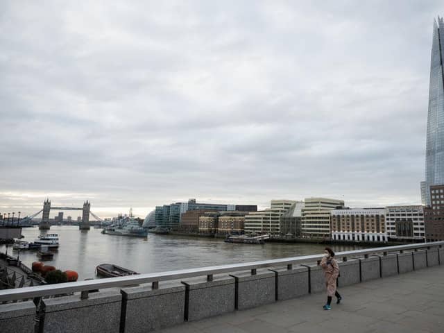 A woman crosses London Bridge during what would usually be the busy pre-9am rush-hour (Photo: Leon Neal/Getty Images)