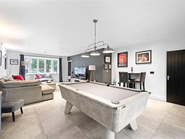 The family room has ample space for relaxing and entertaining with double glazed bay window to the front aspect, bi-folding doors to the rear aspect, tiled flooring with underfloor heating, door leading to the kitchen and hallway.