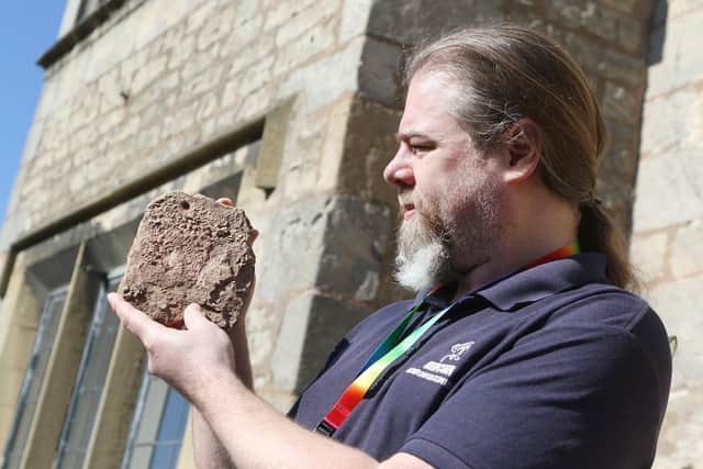 David Budge, of Mercian Archaeological Services, with a medieval roof tile found during last year's excavations at Warsop Old Hall.
