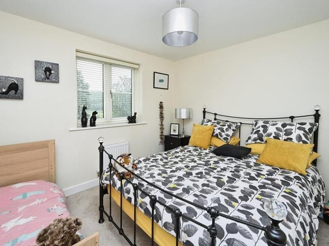 The third bedroom on the first floor is bright and colourful.