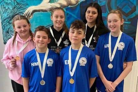 Six Sutton swimmers who won medals in the 1500m freestyle finals,  Molly Etherington, Harry McKeaney, Ellie Read, Ethan Potter, Libby Dove and Amelia Roberts.
