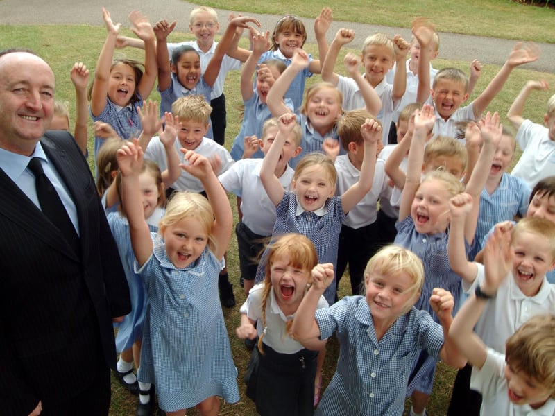 Mr John White and the pupils of Hucknall Leen Mills Primary celebrate receiving a Good rating from OFSTED in 2006.