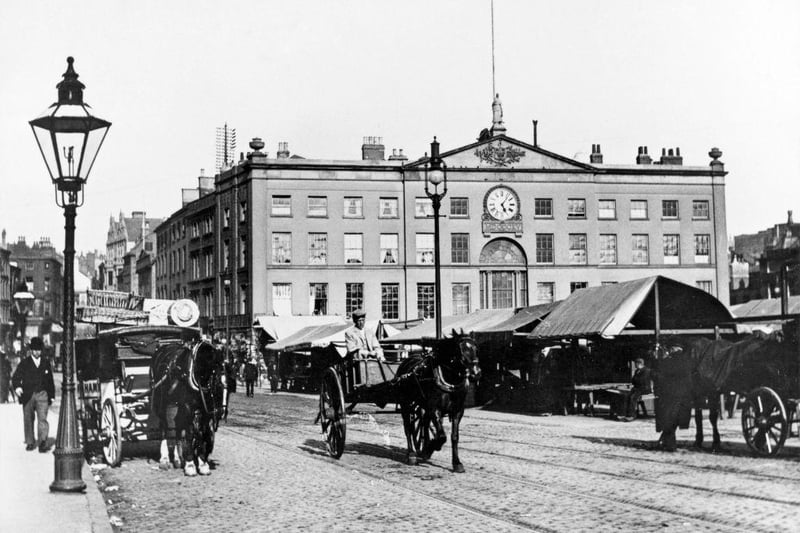 Market day in Nottingham, c1890. This view shows the Exchange from Long Row Central on market day.